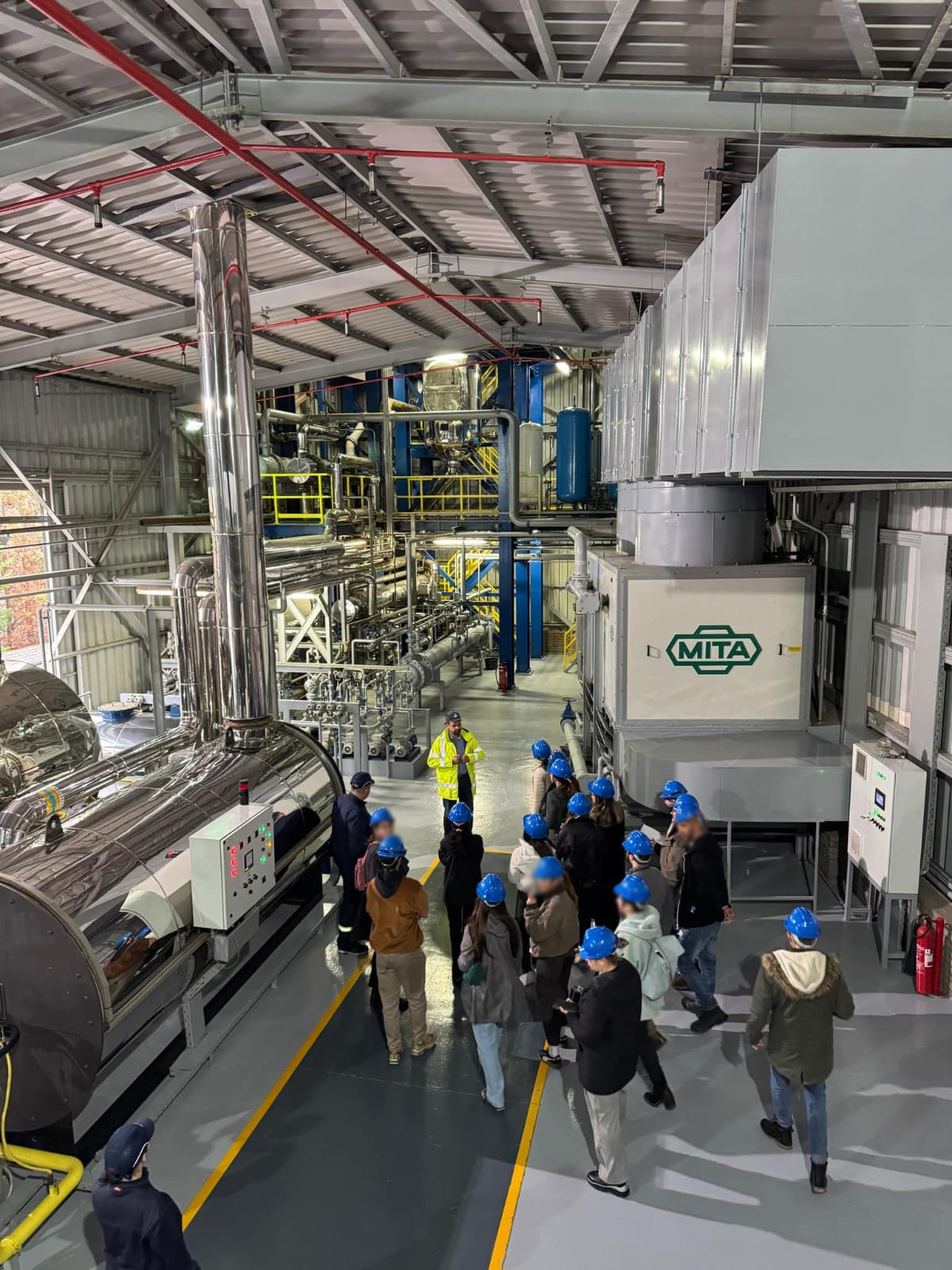 A group of people in a factory AI-generated content may be incorrect.