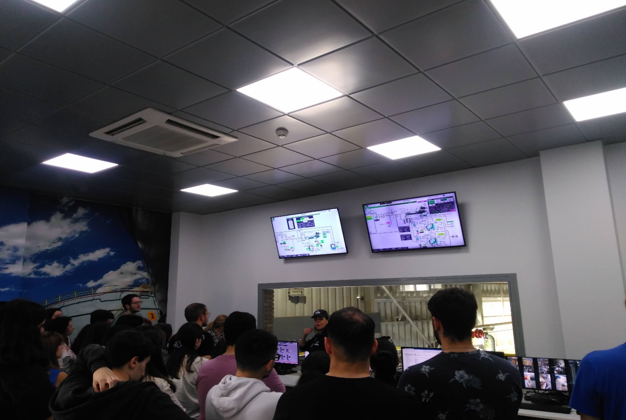 A group of people in a room with computers AI-generated content may be incorrect.