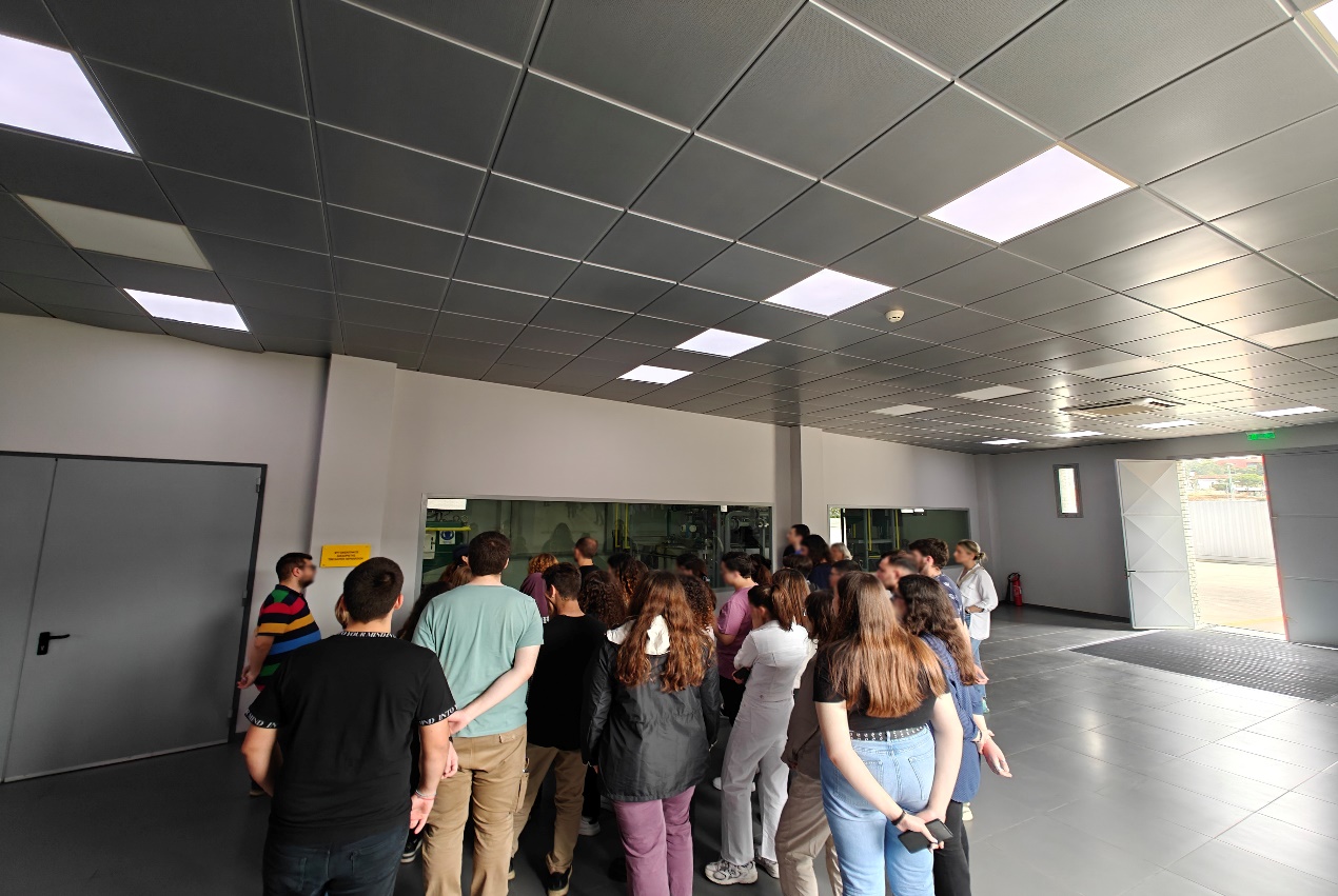 A group of people standing in a room AI-generated content may be incorrect.