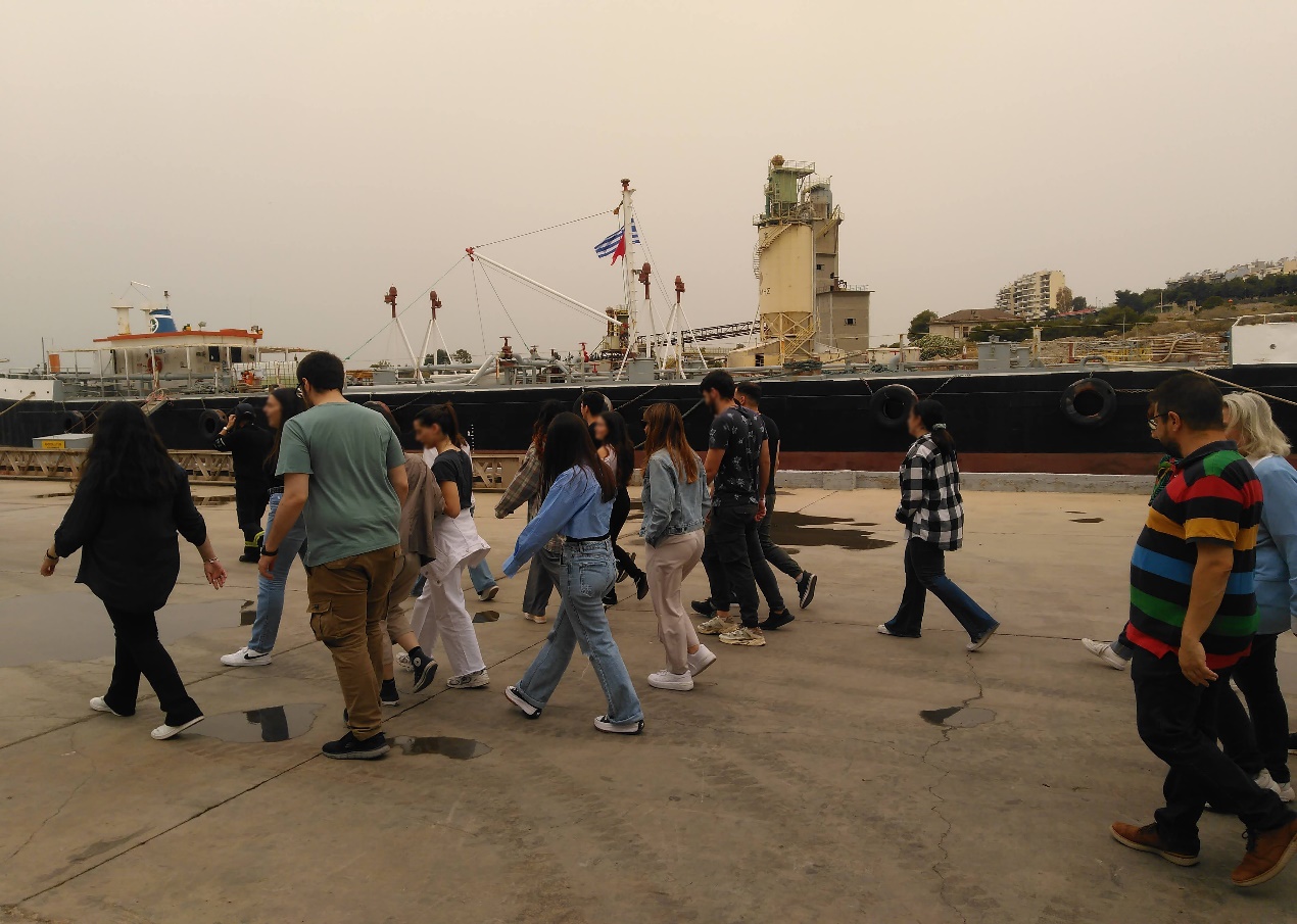 A group of people walking on a dock AI-generated content may be incorrect.