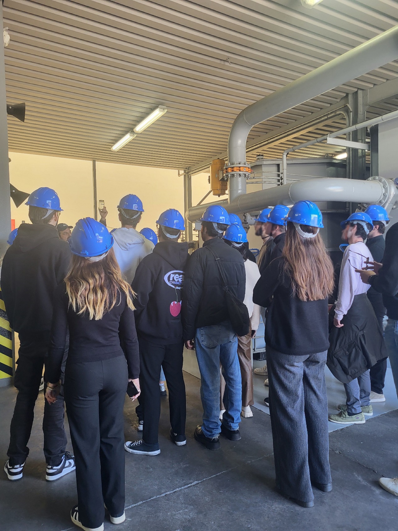 A group of people wearing hard hats AI-generated content may be incorrect.