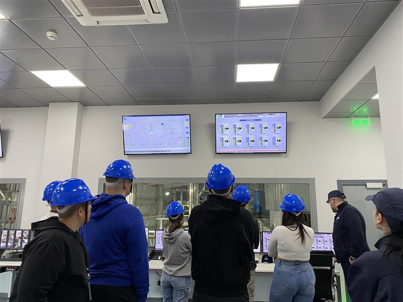 A group of people wearing hard hats AI-generated content may be incorrect.