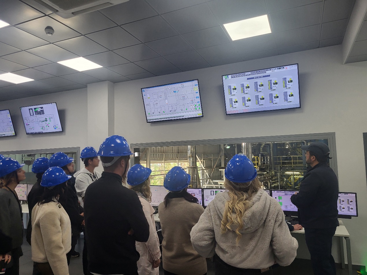 A group of people wearing hard hats AI-generated content may be incorrect.